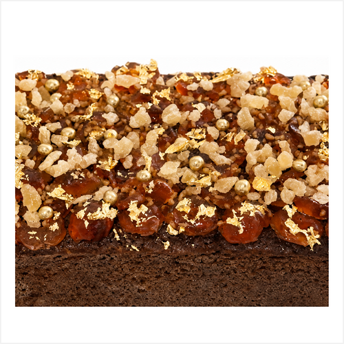 A rich Caribbean Fruitbun, with Guiness Stout, mixed fruits and spices. Topped with glace cherries, sugared ginger pieces, gold leaf and gold balls. Great for Corporate gifting.