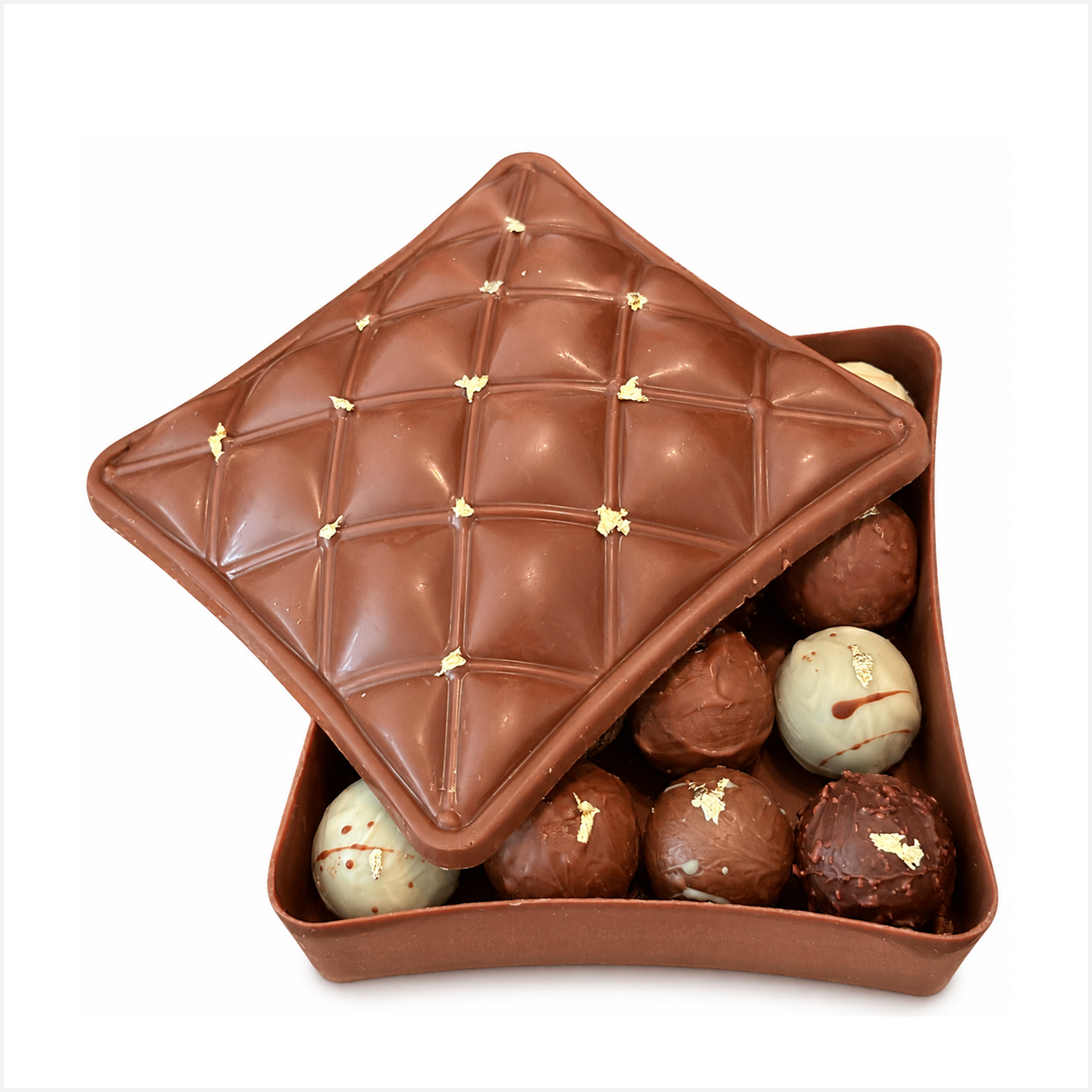 A delicous milk chocolate trinket box with assorted milk, white and dark chocolate truffles. Decorated with speckles of edible gold leaf. Perfect for Corporate gifting.